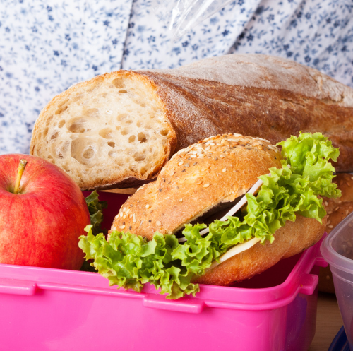 mom packing lunch for teenager
