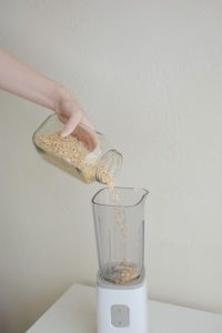 pour oats in blender 